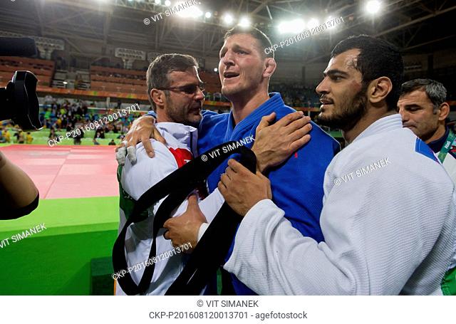 Gold medalist Lukas Krpalek (centre) of the Czech Republic celebrates after the men's -100kg judo contests at the 2016 Summer Olympics in Rio de Janeiro, Brazil