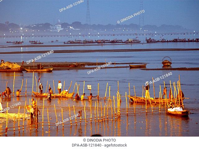 Boats or ferries on the banks of Ganges during the Ardh Kumbh Mela ; one of the world's largest religious festivals at Allahabad ; Uttar Pradesh ; India