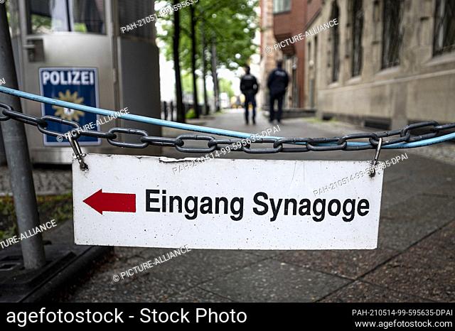 14 May 2021, Berlin: Two policemen walk past the entrance to the New Synagogue Berlin. Photo: Fabian Sommer/dpa. - Berlin/Berlin/Germany