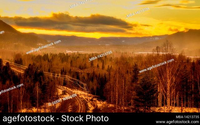 mountain landscape with bridges and railroad during sundown