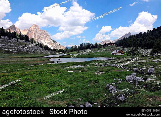 Source lake of the Vigilbach with an alpine pasture on the high plateau in the national park ""Fanes Sennes Braies"" in the South Tyrolean Dolomites