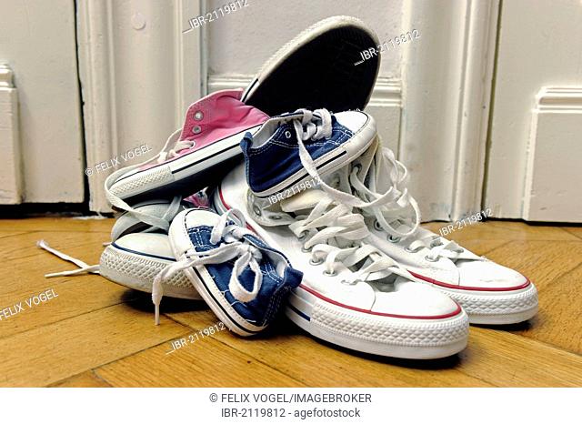 Sport shoes of a family with two children