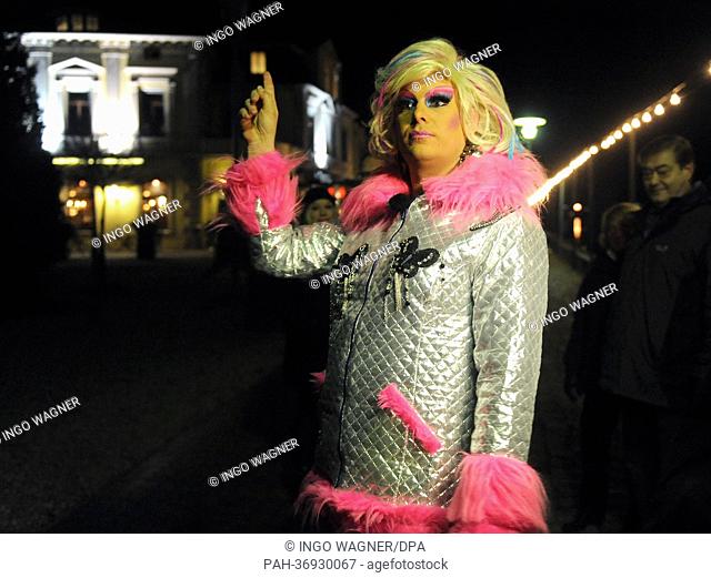 The drag queen Gina Solera guides the participants of her nightly city tour into the port of Oldenburg, Germany, 09 February 2013