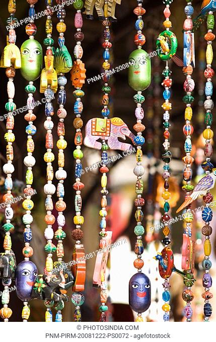 Beaded curtain for sale at a market stall, New Delhi, India
