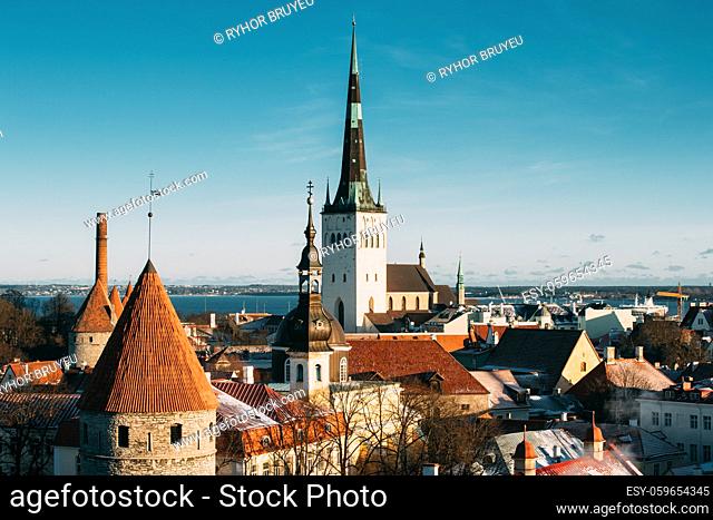 Tallinn, Estonia. Part Of Tallinn City Wall With Towers, At The Top Of Photo There Is Tower Of Church Of St. Olaf Or Olav. Popular Destination Scenic