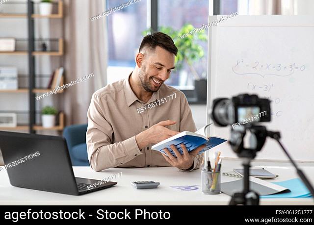 male math teacher having online class at home