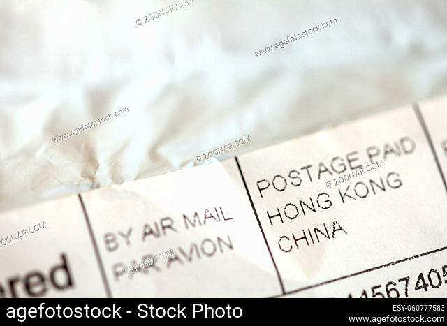 Detail photo - address on package envelope of stuff ordered from Chinese eshop. Shopping from online retailers in Asia concept.