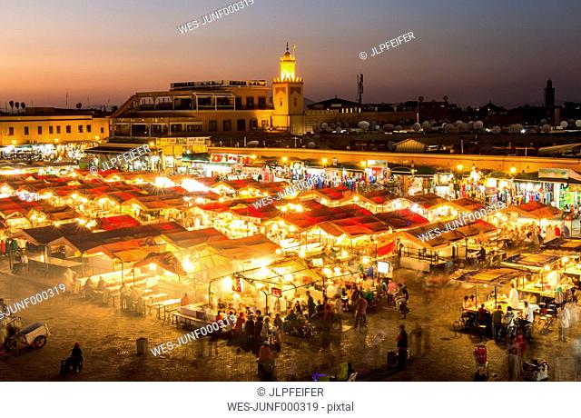 Morocco, Marrakesh, view to lighted Jemaa el-Fnaa bazaar in the evening