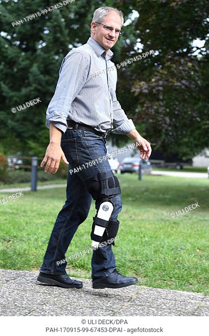 Christian Pylatiuk of the Automated Image and Data Analysis working group wears an orthosis on his right leg, which has been designed to generate electricity...