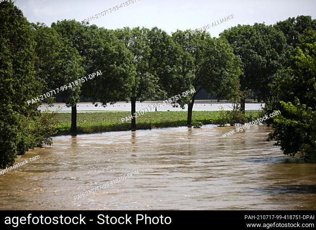 17 July 2021, North Rhine-Westphalia, Orsbeck: The water from the river Rur has flooded the surrounding meadows in Orsbeck