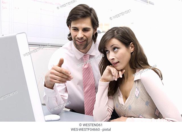 Man and woman in office
