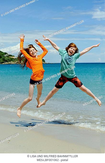 France, Corsica, Favone, children having fun at a beach