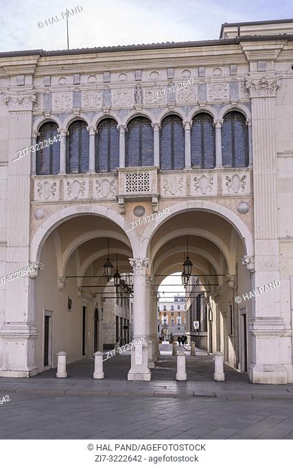 arches and vaults of decorated covered passage on Loggia square, shot in bright winter light at Brescia, Italy