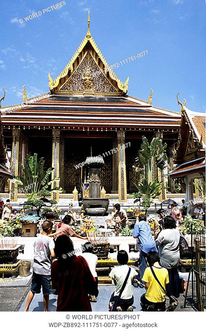 Emerald Temple at Grand Palace Bangkok Thailand, showing visitors lighting candles Date: 22 02 2008 Ref: ZB892-111751-0077 COMPULSORY CREDIT: World...