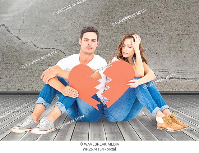Sad couple sitting together with broken hearts