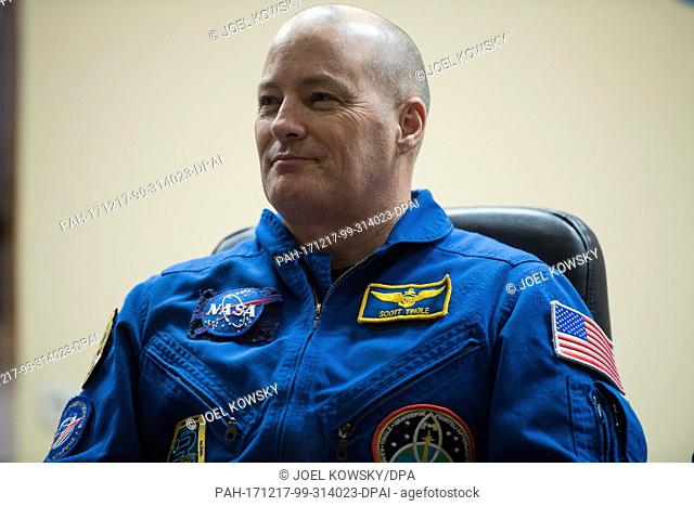 Expedition 54 flight engineer Scott Tingle is seen in quarantine, behind glass, during a press conference, Saturday, December 16
