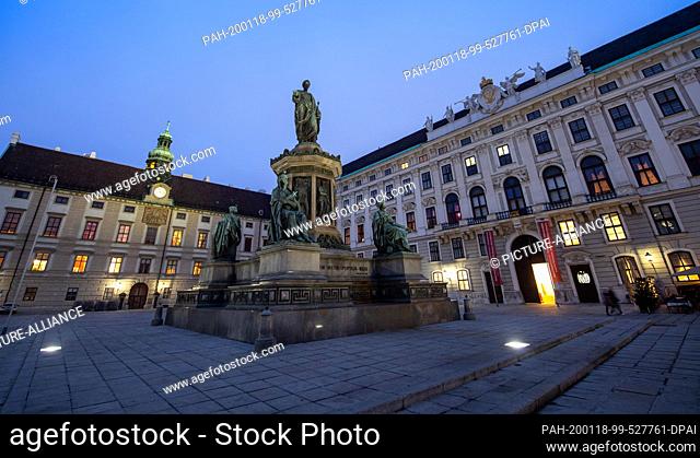 17 January 2020, Austria, Wien: View in the evening to the monument Franz I. in the outer courtyard of the Vienna Hofburg
