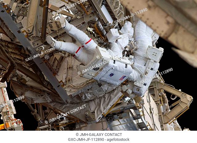 Astronauts Heidemarie Stefanyshyn-Piper (left) and Steve Bowen, both STS-126 mission specialists, participate in the mission's first session of extravehicular...