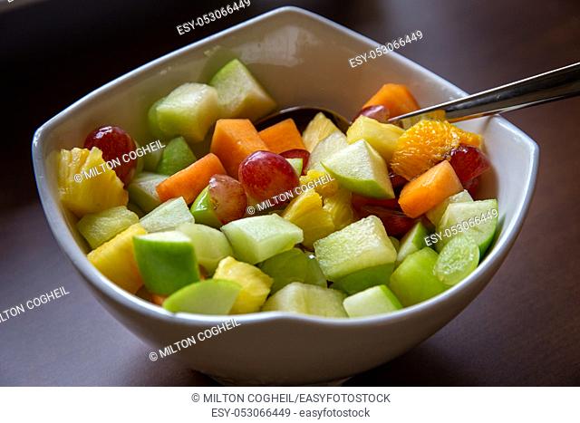 Large white bowl of healthy fresh fruit salad