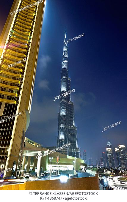 The Burj Al Khalifa tower illuminated at night near the Dubai Mall in Dubai, UAE