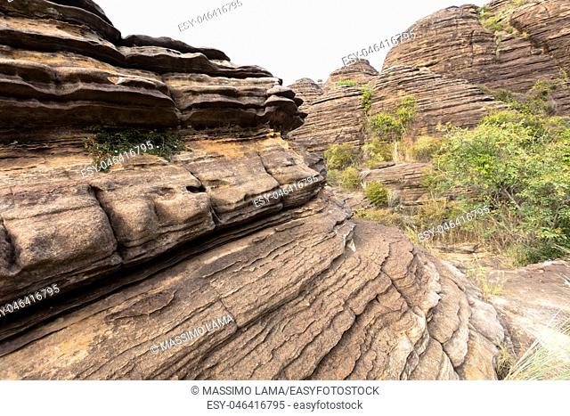 the Domes de Fabedougou are natural phenomenon of rock sculpted by vwind and erosion in Burkina faso look like a stack of pancakes