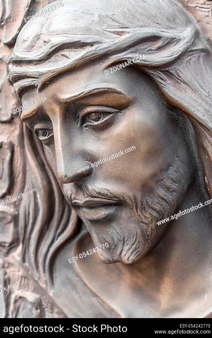 Bronze statue of the face of jesus with a crown of thorns. Ancient sculpture. Ideal for concepts or events like Easter