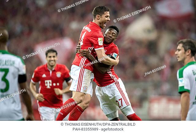 Bayern's Xabi Alonso and David Alaba celebrating the 1:0 goal by Xabi Alonso during the Bundesliga soccer match between FC Bayern Munich and SV Werder Bremen at...