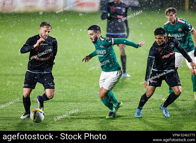 Lommel's Robin Henkens, Virton's Anas Hamzaoui and Lommel's Alonso Martinez fight for the ball during a soccer match between Royal Excelsior Virton and Lommel...