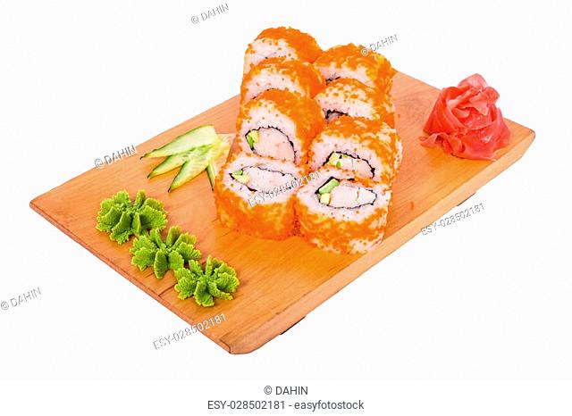 8 delicious sushi with red caviar and wasabi on a wooden tray