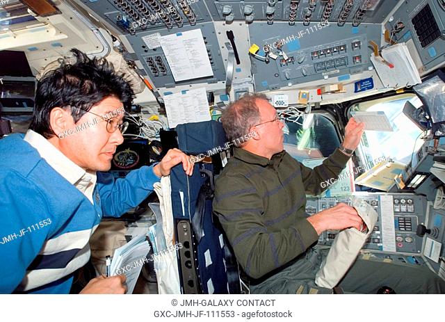 NASA astronaut Dominic Gorie (right), STS-123 commander; and Japan Aerospace Exploration Agency (JAXA) astronaut Takao Doi, mission specialist