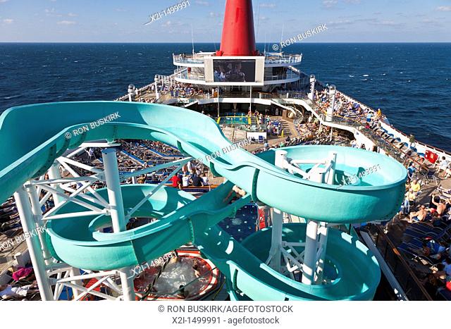 Cruise passengers on deck and waterslide on Carnival's Triumph cruise ship in the Gulf of Mexico