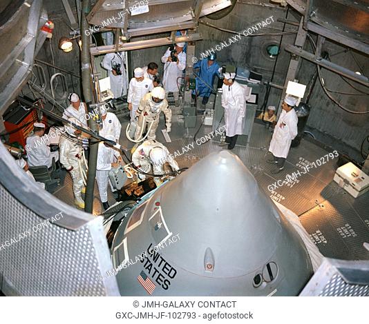 The Apollo 1 prime crewmembers for the first manned Apollo Mission (204) prepare to enter their spacecraft inside the altitude chamber at the Kennedy Space...