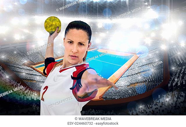 Composite image of sportswoman throwing a ball