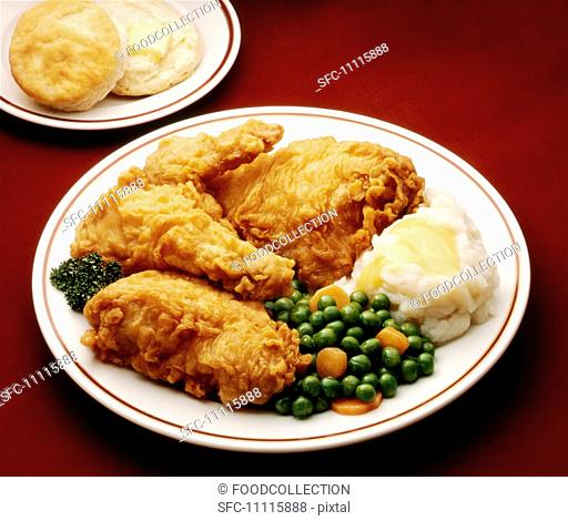 Fried Chicken Dinner Plate, Fried Chicken, Mashed Potato, Peas and Carrots and a Biscuit