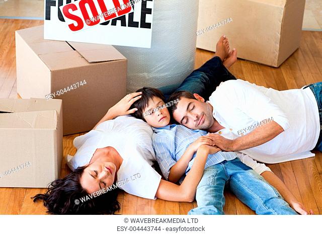 Family moving house sleeping on floor