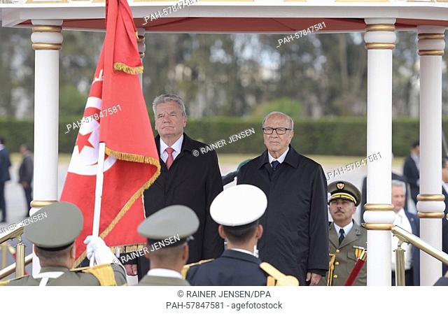 German President Gauck is received with military honours by the President of Tunisia Beji Caid Essebsi (R) upon arrival at Tunis airport, Tunisia, 27 April 2015
