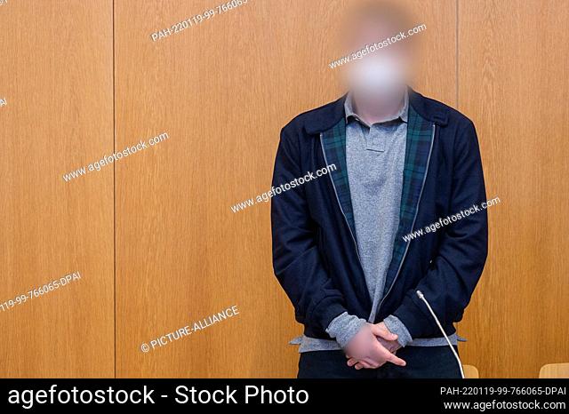 19 January 2022, Bavaria, Landshut: The defendant stands in the hearing room of the district court. The prosecution accuses the 25-year-old man of shooting a...