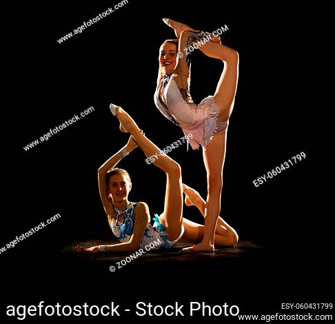 Young girls engaged art gymnastic isolated
