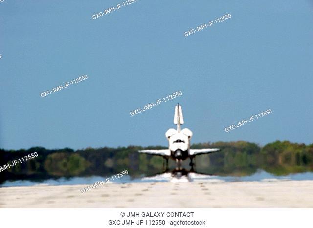 Space shuttle Discovery rolls down Runway 15 at the Shuttle Landing Facility at NASA's Kennedy Space Center in Florida. Landing was at 11:57 a.m