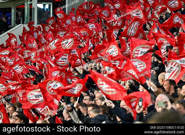 fans and supporters of PSV waving flags during the Uefa Champions League matchday 4 game in group B in the 2023-2024 season between PSV Eindhoven and Racing...