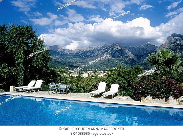 View towards Sòller and Serra del Tramuntana, swimming pool with deckchairs, country hotel, Finca Ca'n Coll, Sòller, Majorca, Balearic Islands, Spain, Europe