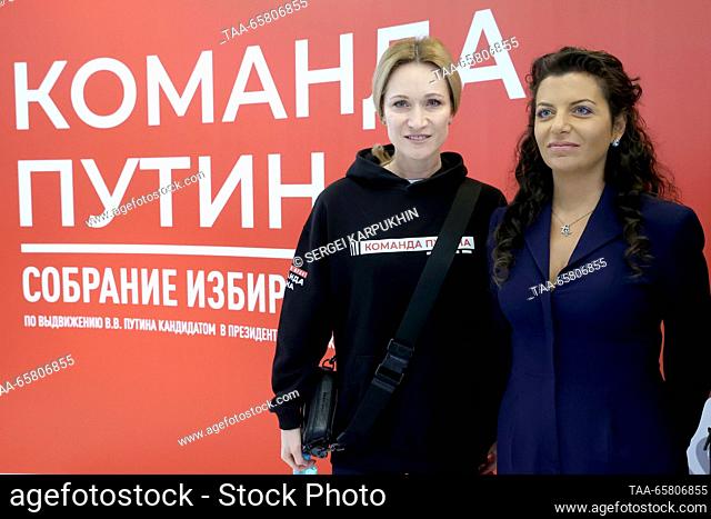 RUSSIA, MOSCOW - DECEMBER 16, 2023: Synchronised swimmer and TV host Maria Kiseleva (L) and RT editor-in-chief, Rossiya Segodnya editor-in-chief Margarita...