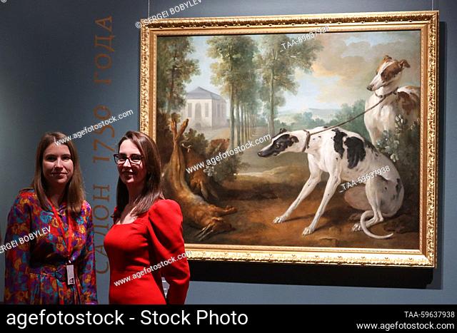 RUSSIA, MOSCOW - JUNE 5, 2023: Women stand before Hunting Dogs and Dead Hares by Jean-Baptiste Oudry, ca 1750, during an exhibition titled ""Salons by Diderot