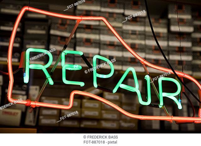 Neon shoe repair sign