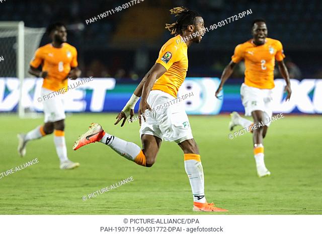 11 July 2019, Egypt, Suez: Cote d'Ivoire's Jonathan Kodja celebrates scoring his side's first goal during the 2019 Africa Cup of Nations quarter final soccer...