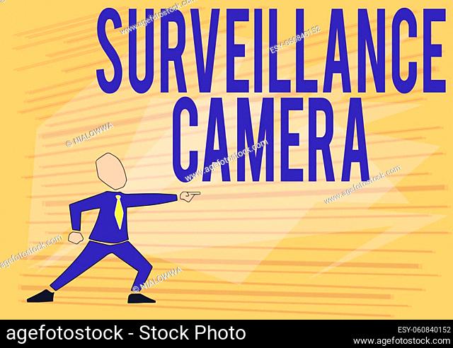 Sign displaying Surveillance Camera, Word for Closed Circuit Television transmit signal on monitors Man In Suit Drawing Pointing Forward Showing Leadership