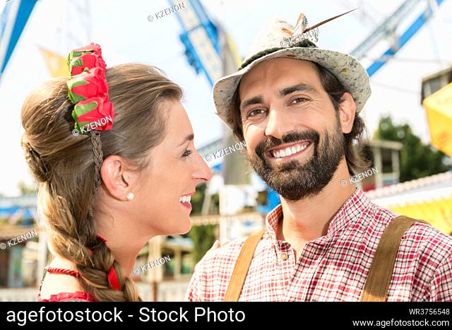 Man and woman in Bavarian Tracht on the Oktoberfest in Munich