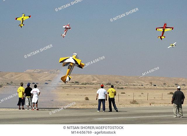 Open air model planes airshow. Arava Region, Israel. The model planes stand still in the air for seconds
