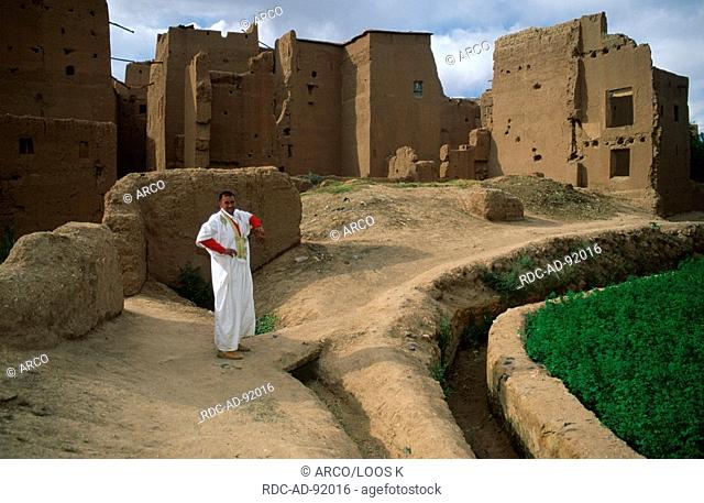 Man in traditional clothes at ruins, Tinerhir, High Atlas, Morocco
