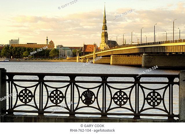 Church of St. Peter and the Old Town at dusk from across the river Daugava, Riga, Latvia, Baltic States, Europe